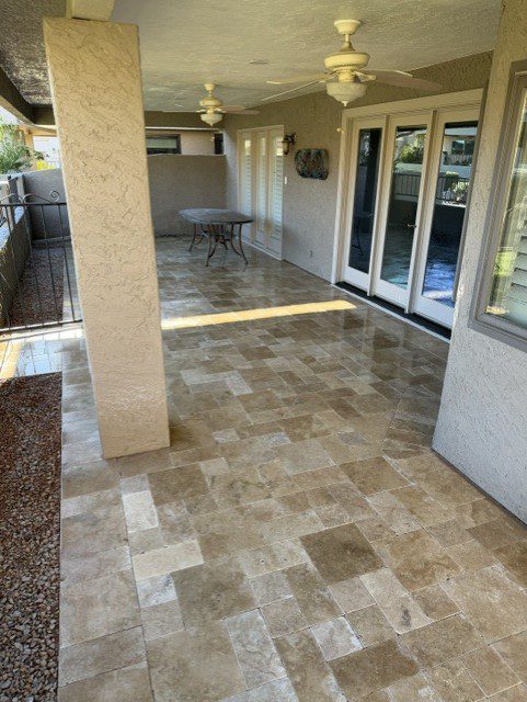 Remodeled covered patio with travertine pavers in Phoenix, Arizona