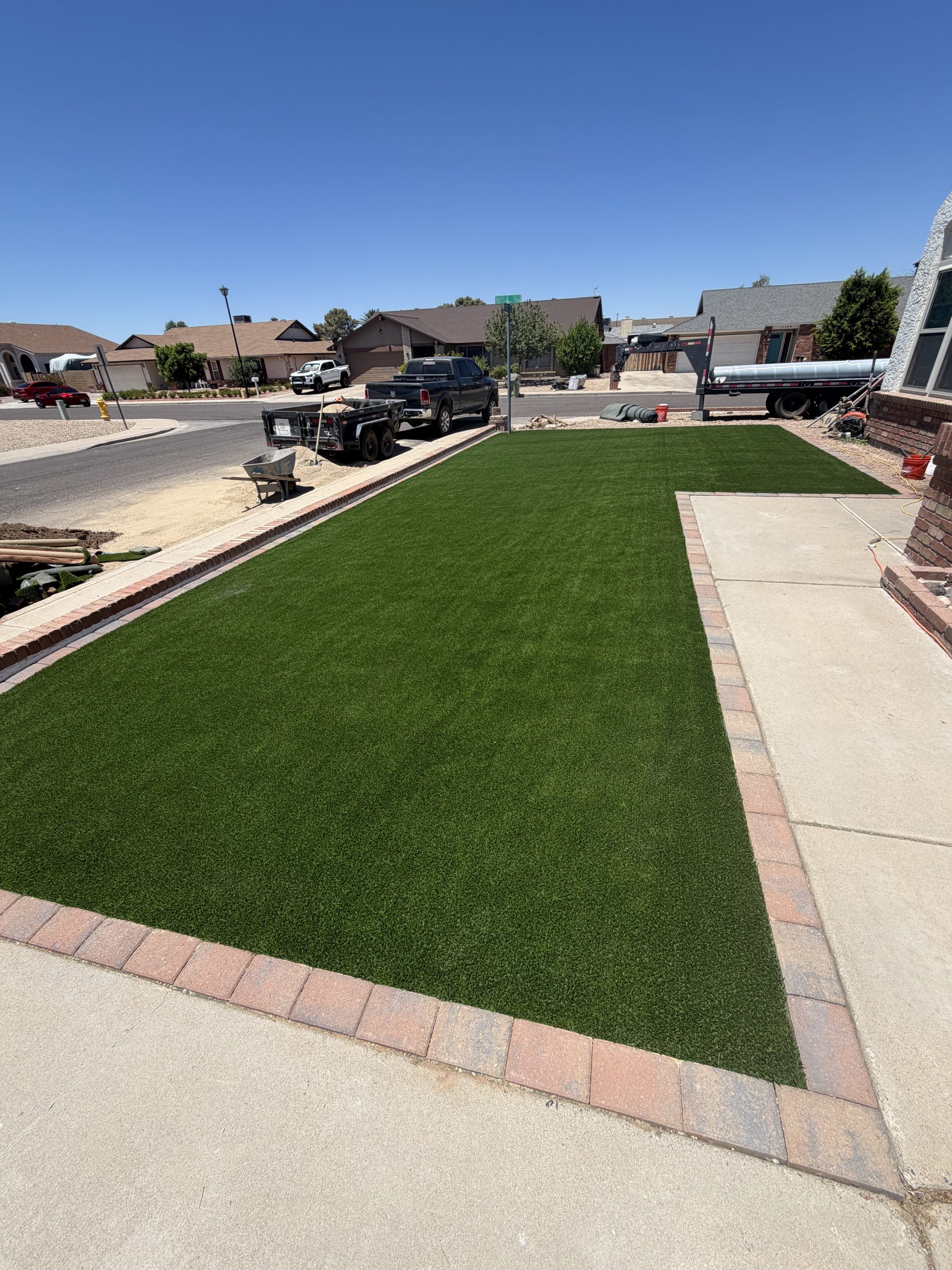 Front yard artificial turf lawn with paver border by TJ Landscape in Phoenix, AZ – after