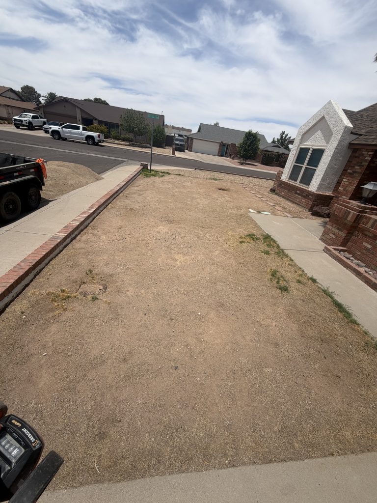Bare dirt front yard before artificial turf installation in Phoenix, Arizona
