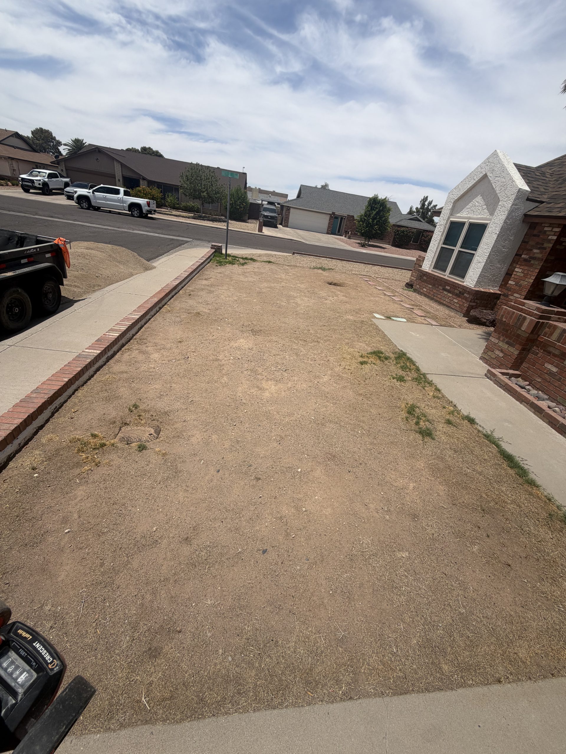 Dead, patchy front lawn before artificial turf installation in Phoenix, AZ